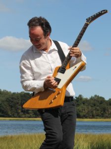 This is a picture of Geroge A. Barry with his elecric guitar